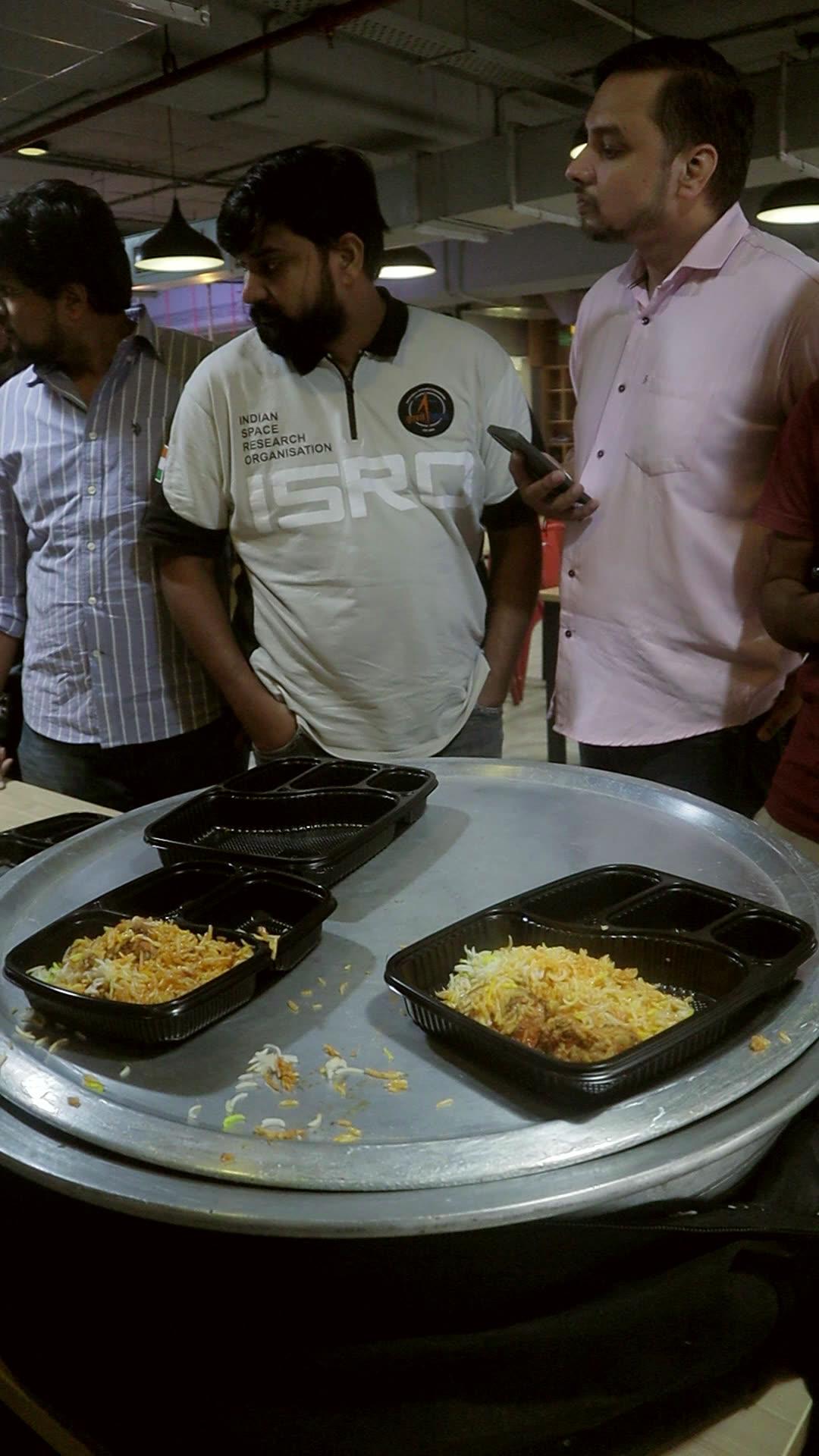Office team queueing at the biryani counter